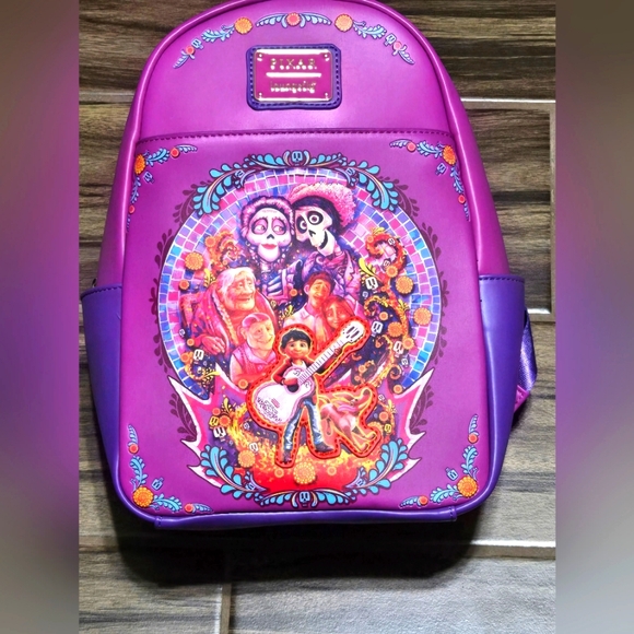 Loungefly Disney Pixar Coco Family Mural Mini Backpack NWT purple